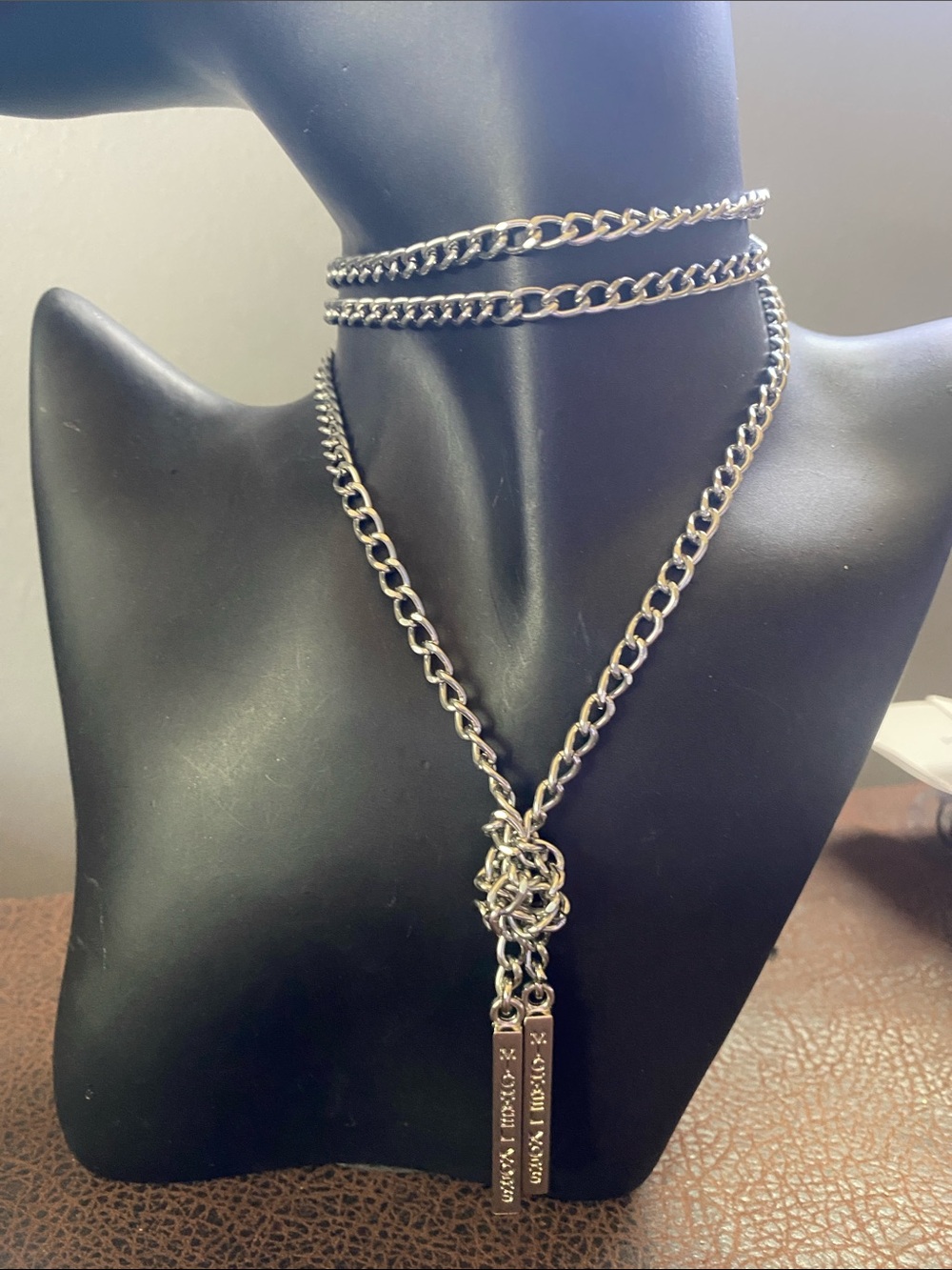Michael Kors Signature Bars attached to long chain, lace up dresses or lariat
